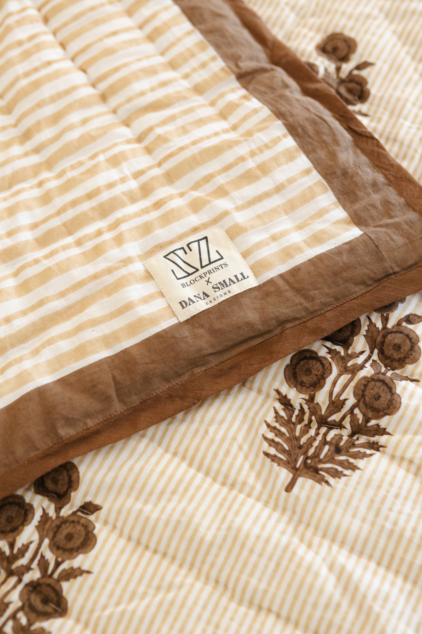 Razai Quilt in Poppy Stamp, Chicory Coffee & Almond Bluff